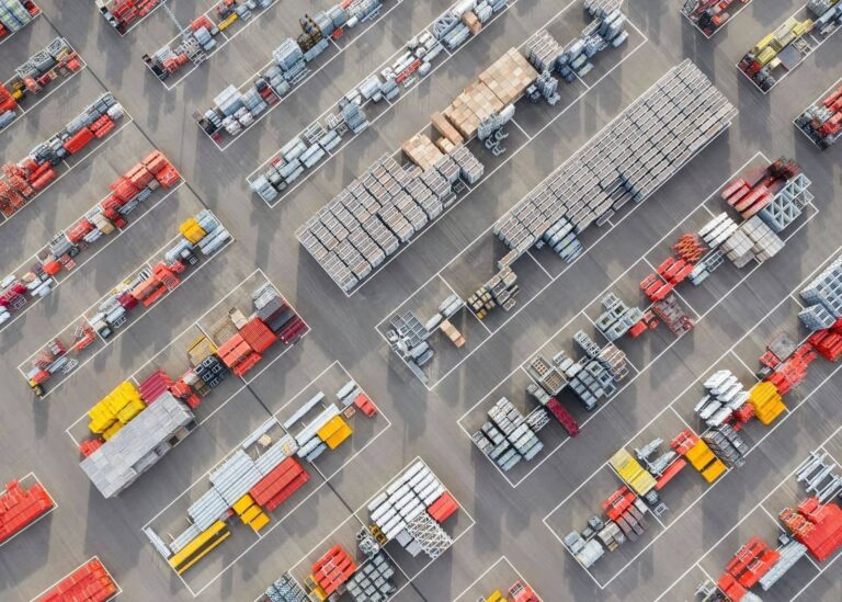 Aerial view of a cross-dock industrial facility with trailers